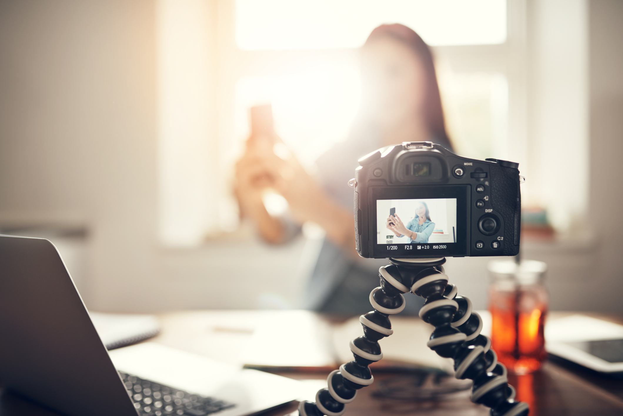 Camera on tripod recording a hiring culture video