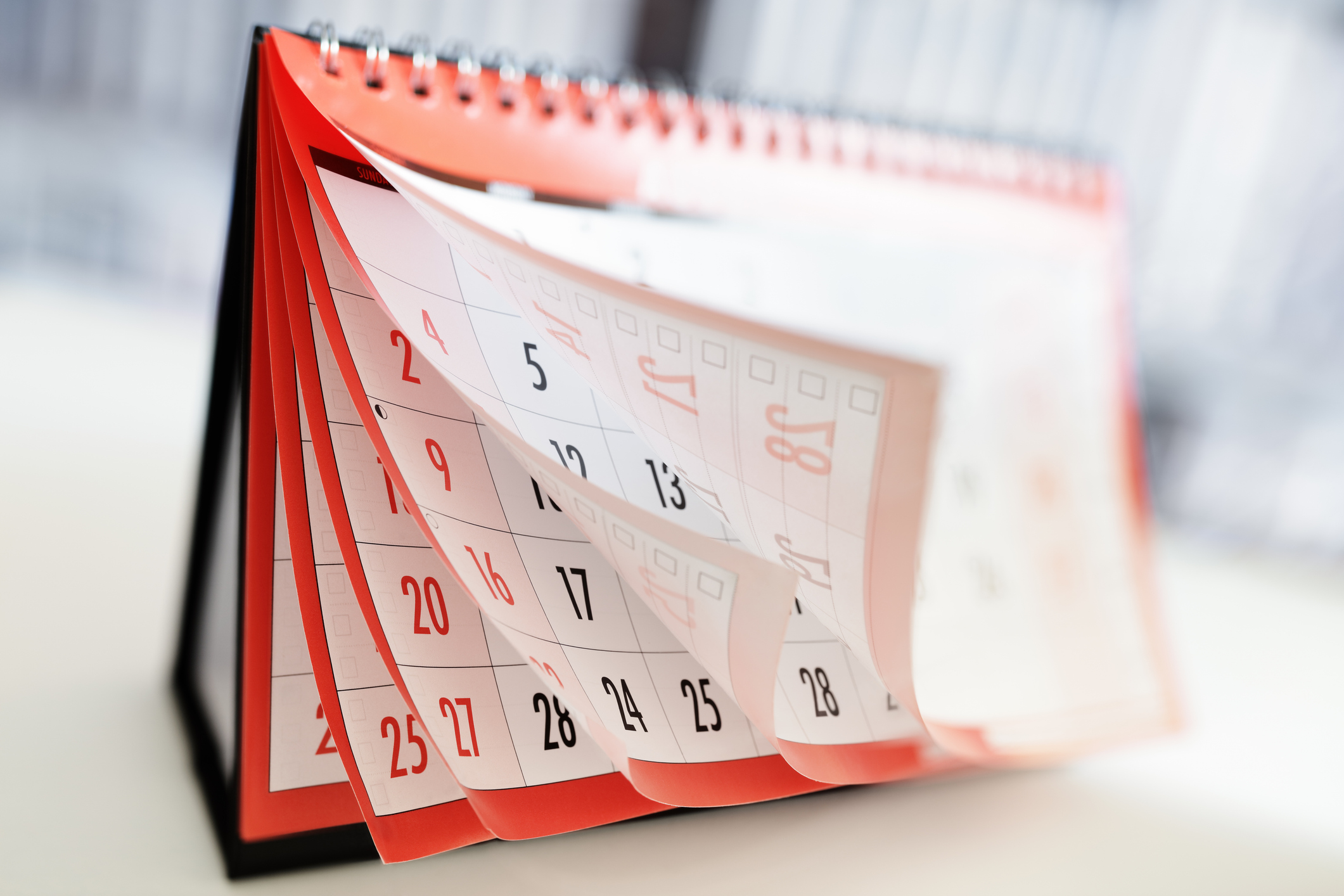 Desk calendar pages flipping through the months