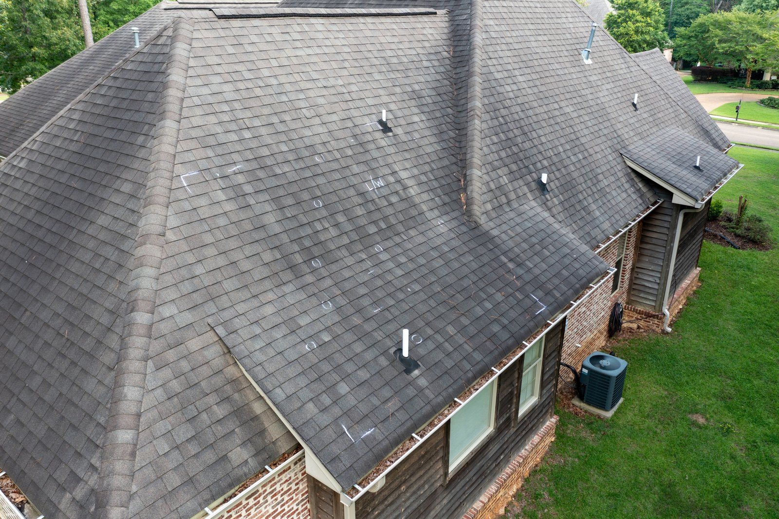 Aerial view of a residential shingle roof during a roof inspection